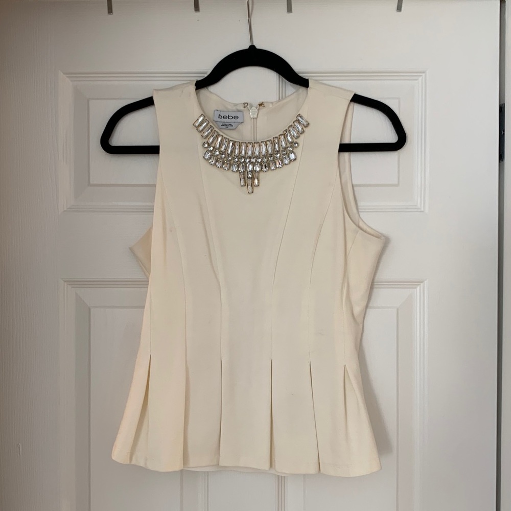 Worn once bebe beaded peplum top size medium